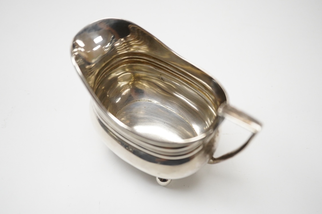 A late 19th/early 20th century matched silver three piece tea set, by W & G Sissons, London, 1898 and The Barnards, London, 1903, gross weight 33oz.